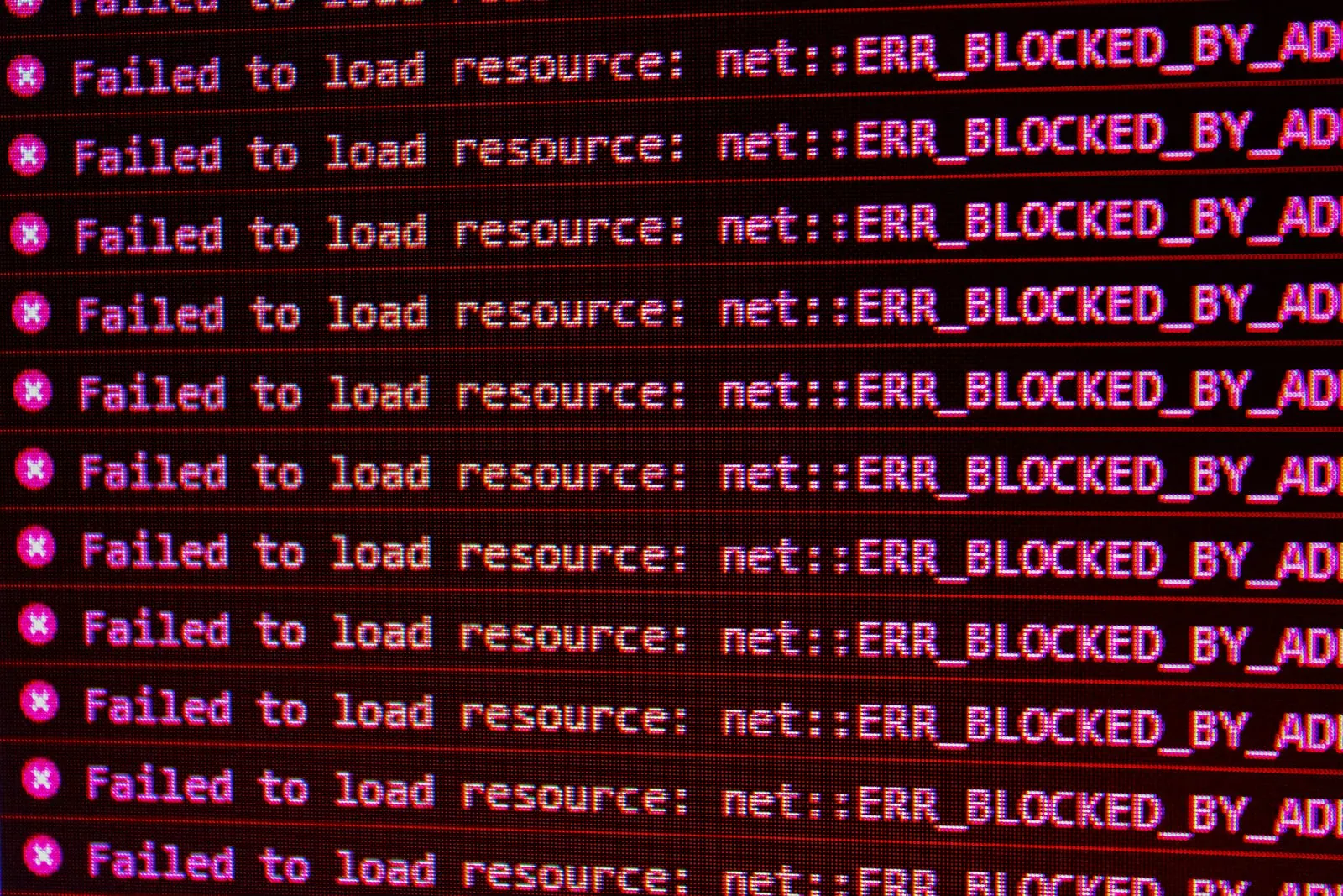 A browser console filled with repeated “Failed to load resource” errors.