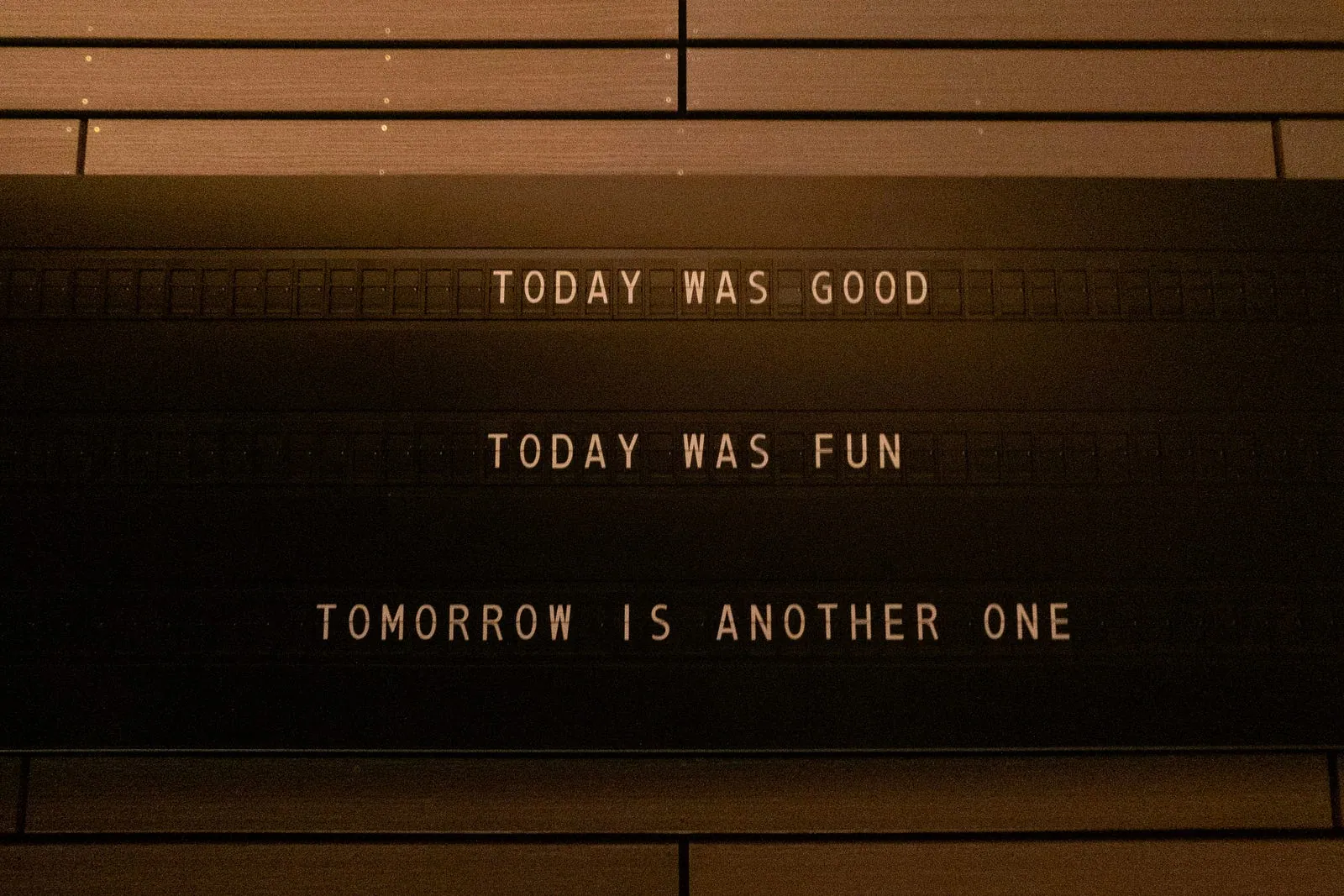 A letter board reading “Today was good. Today was fun. Tomorrow is another one.”